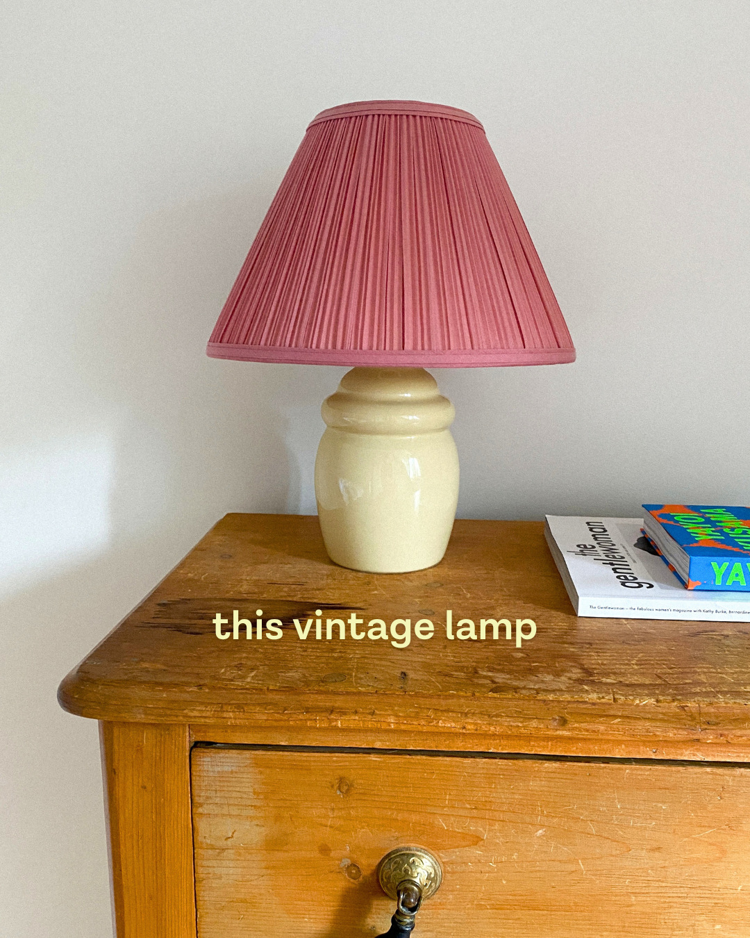 Slide captioned 'this vintage lamp', showing a pleated pink lampshade on a cream ceramic base on a wooden chest of drawers (slide 4 of 4)