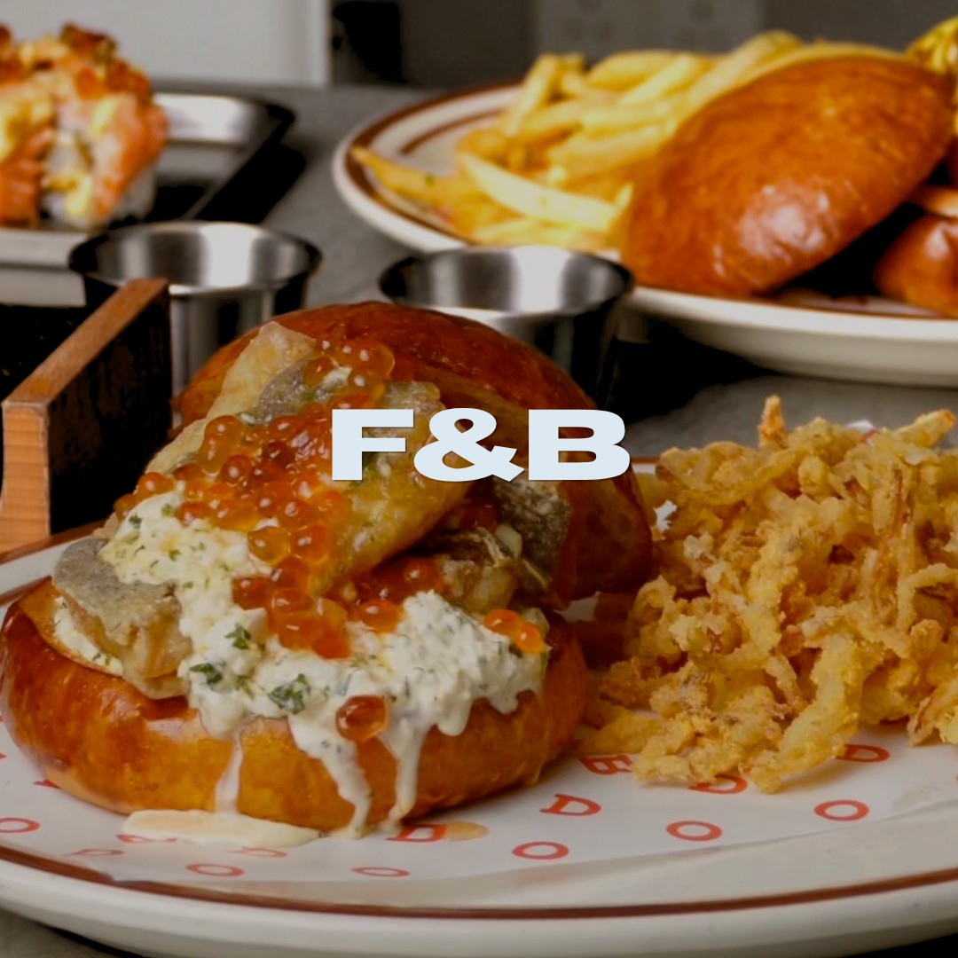 F&B: a brioche burger topped with salmon roe next to fried onions, with the title 'F&B'